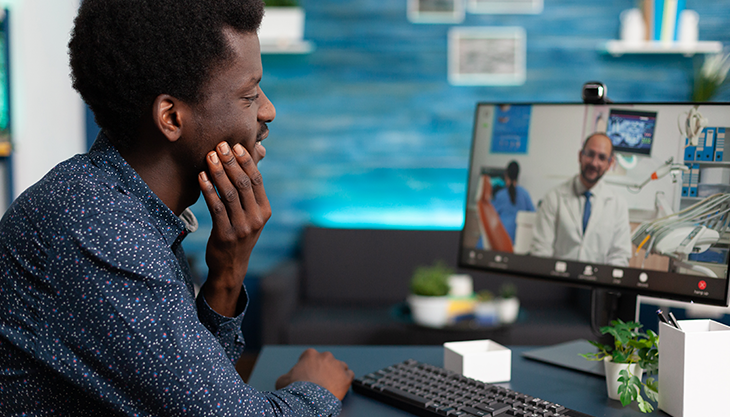 A patient consulting with a doctor through telemedicine.