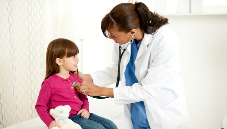 An FQHC doctor seeing to a young patient