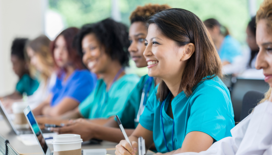 CHC provider happily engages during the CHI 2024, taking down notes during a training session