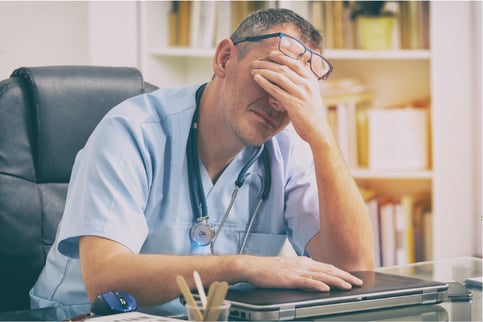 Provider very tired at his desk