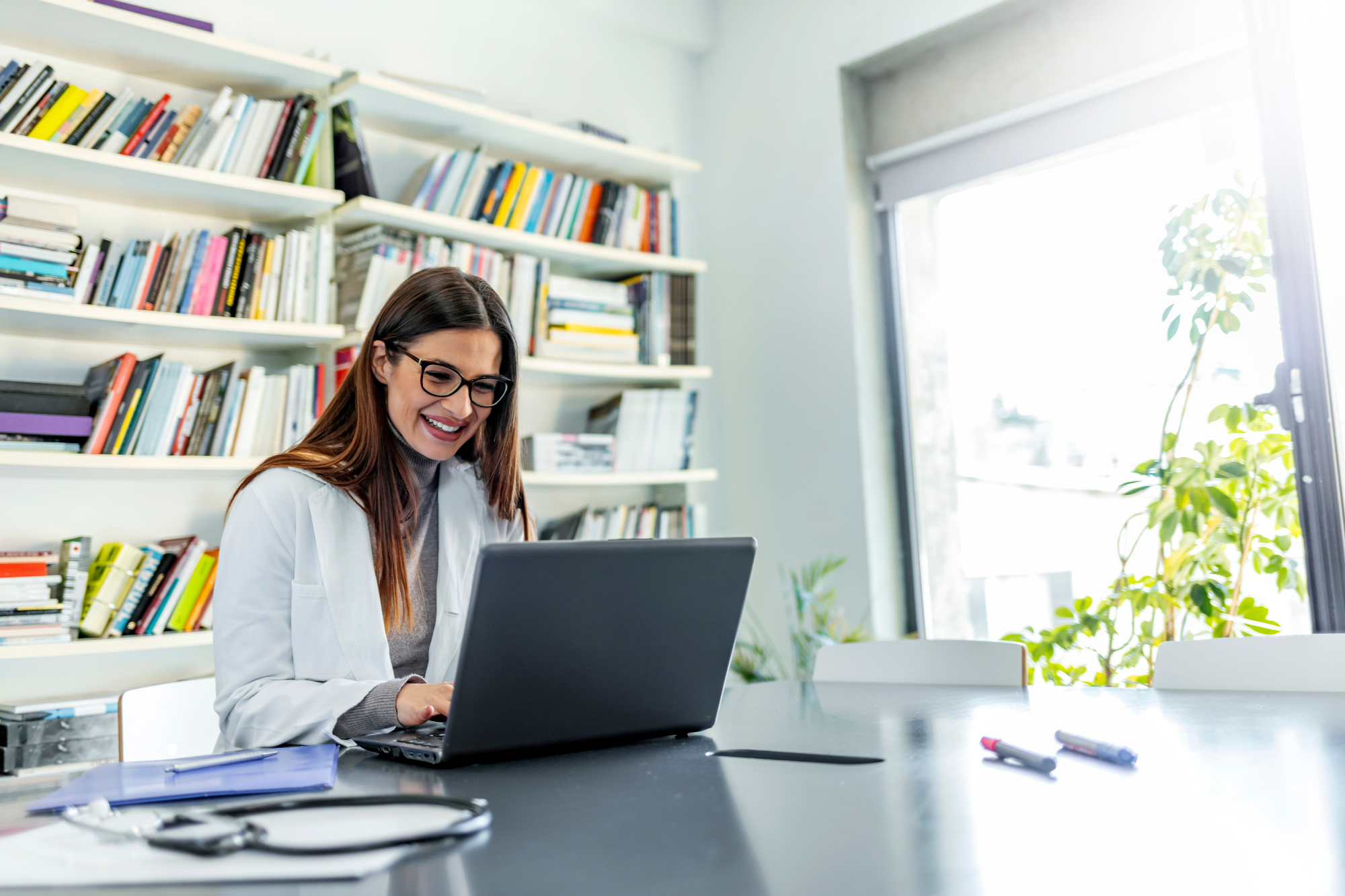 IMS Practice Analytics helps deliver operational efficiency in healthcare practices. The practice owner smiles as they make data-backed decisions that drive growth.