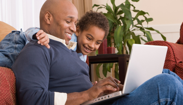 A father using a patient portal to manage his health