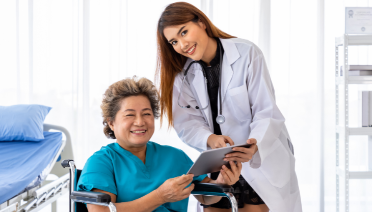 A doctor and her patient smiling demonstrating a positive patient experience.