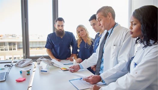 Providers reviewing documents together