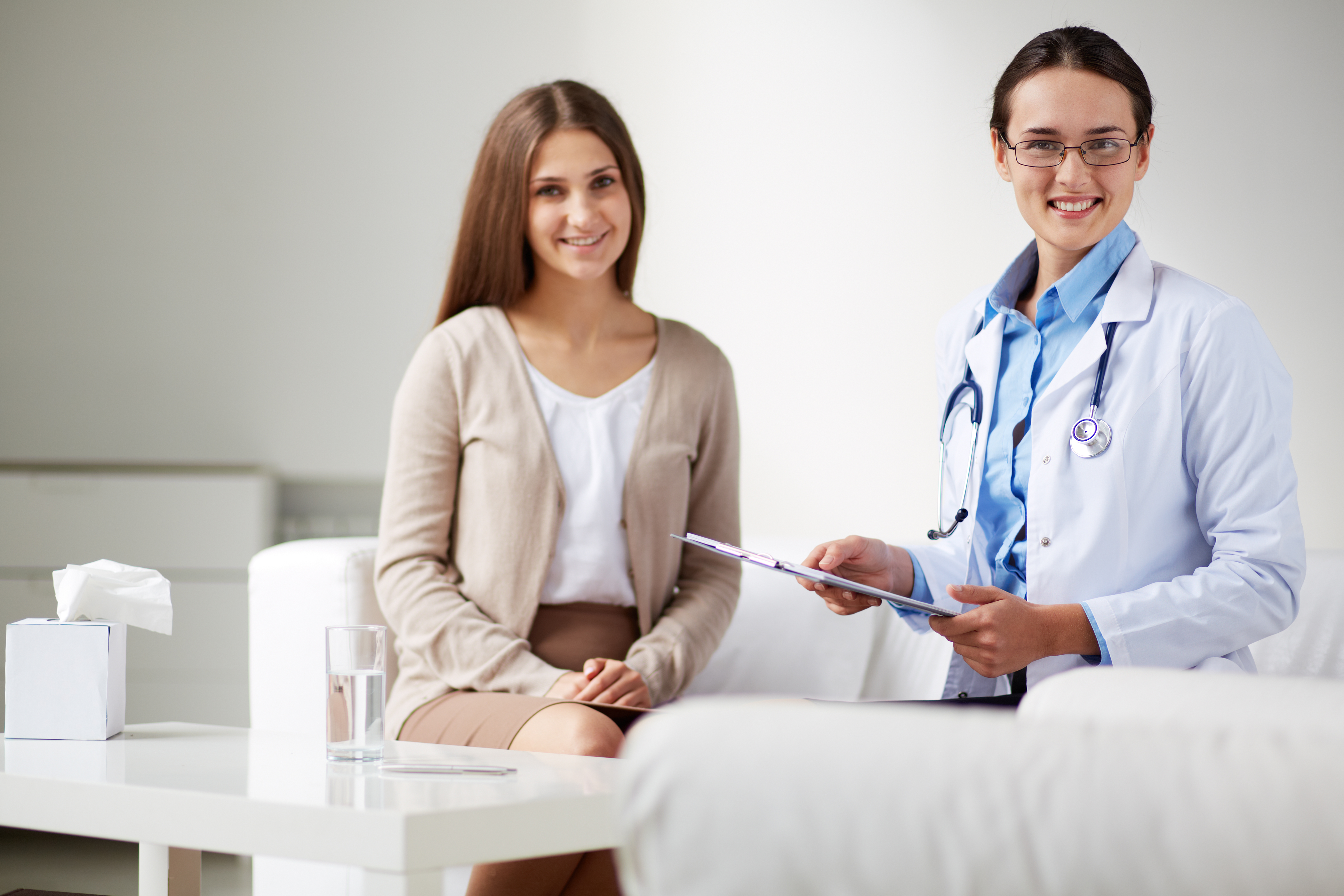 A female patient having a consultation with her doctor about her fertility treatment plan