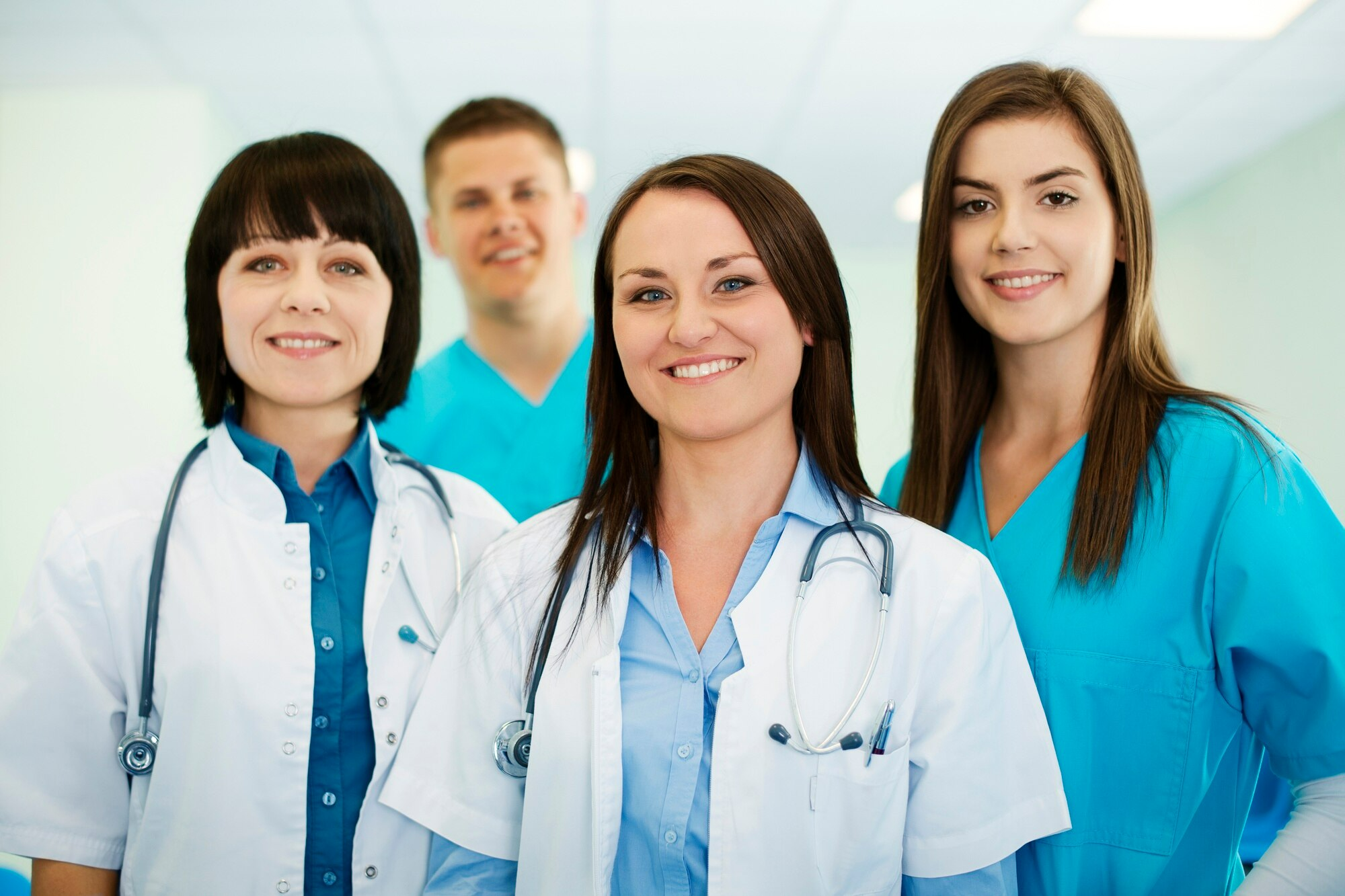 Clinic staff members look satisfied after using IMS for healthcare practices. 