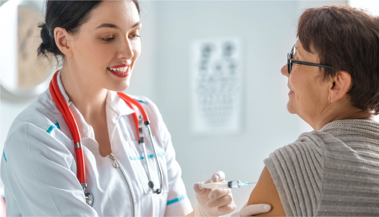 Patient Receiving an injection into the arm by her provider