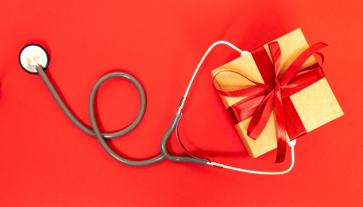 A Gold Wrapped Gift with a Medical Stethoscope