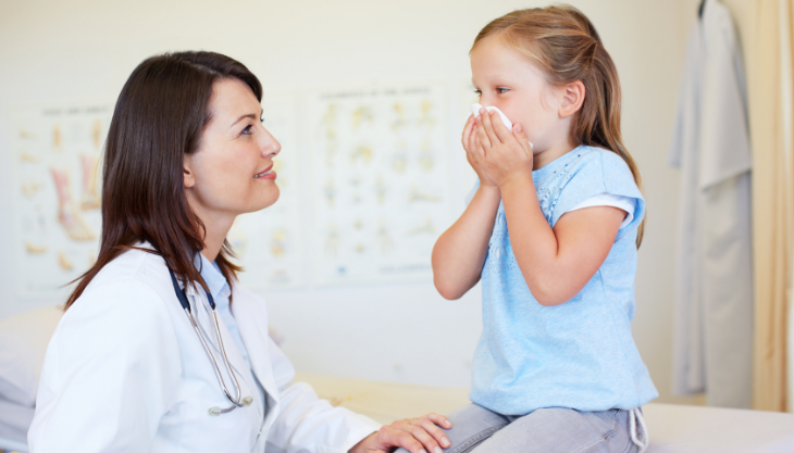 A happy allergist who has a good allergy EHR, allowing her to work with her patient 
