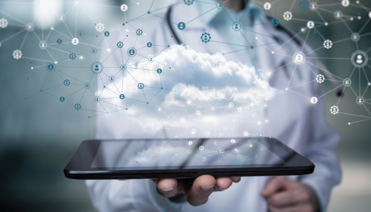 doctor holding a tablet for remote patient monitoring