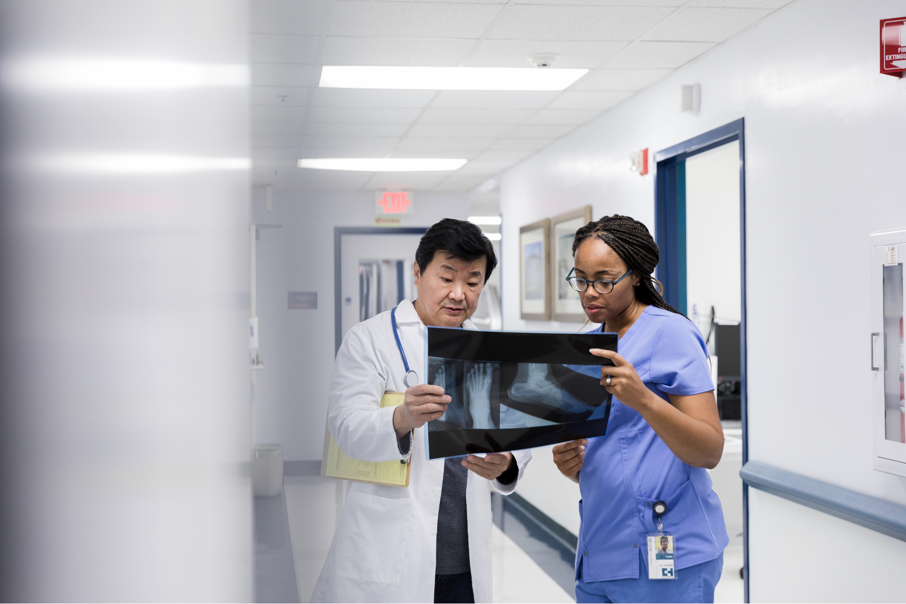 healthcare staff in an orthopedics clinic checking monitor